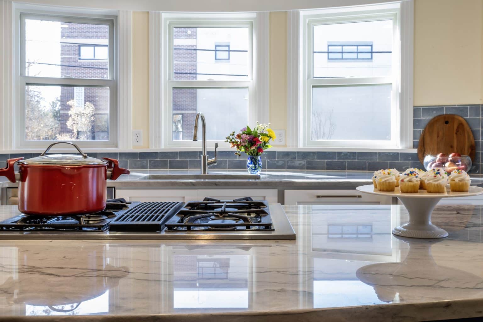 Post-Denver home addition - new kitchen island with the view 18-print-S Logan St-9992 with a view of Denver Wash Park out the windows