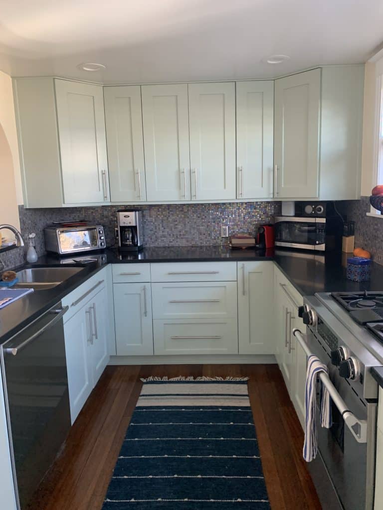 View of the small galley kitchen before the whole house structural remodel 3-story home addition in Wash Park Denver home